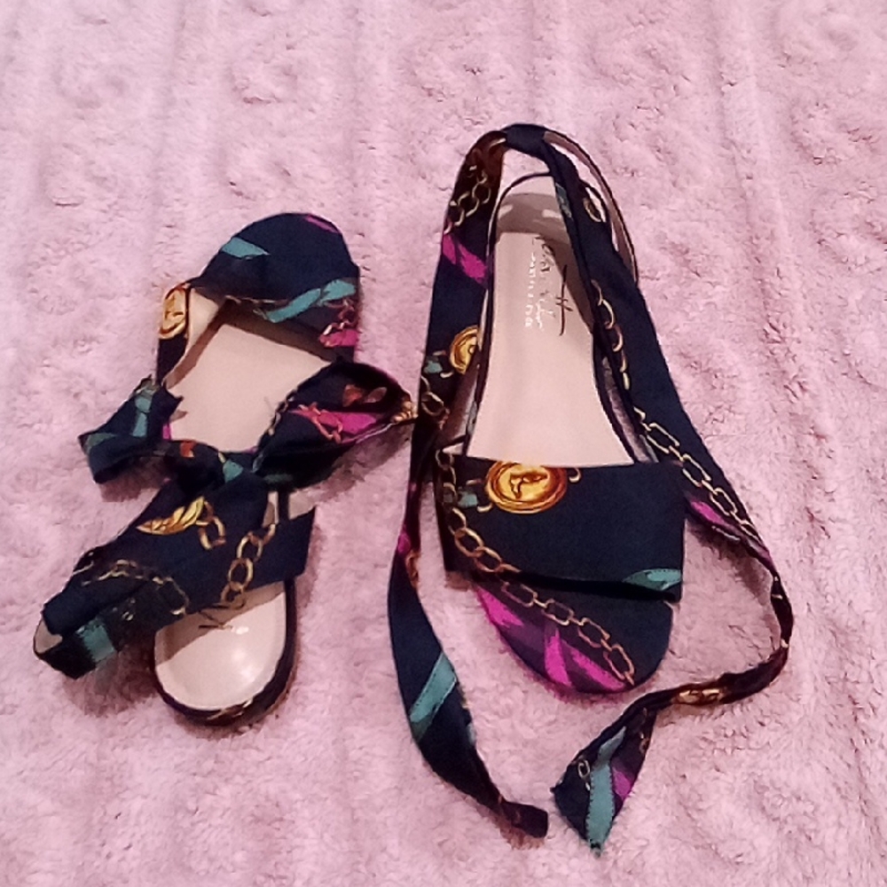 Nanette Lepore Black and Gold Sandals with Elegant Design